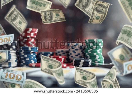 poker chips stack on table at casino, rain money fly dollar as big chance to win. Gambling concept