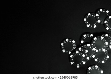 Poker game. Casino chips on black table, top view. Space for text - Powered by Shutterstock