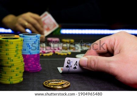 Poker game at the casino gambling table