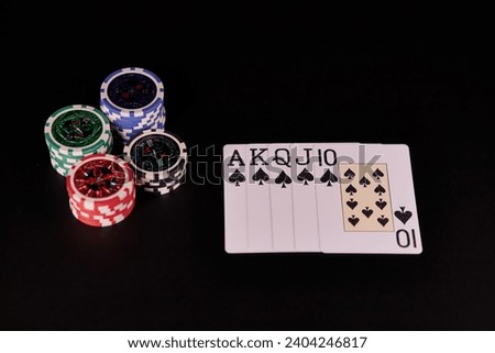 Poker Hands - Royal Flush. Five playing cards - the poker royal flush hand. Royal Flash, card deck, poker royal flash on cards and poker chips on green casino table. success in gambling. soft focus