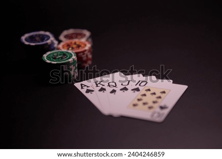 Poker Hands - Royal Flush. Five playing cards - the poker royal flush hand. Royal Flash, card deck, poker royal flash on cards and poker chips on green casino table. success in gambling. soft focus