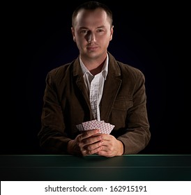 Poker player on a dark background