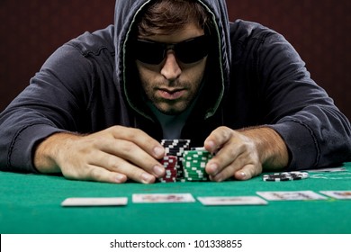 Poker Player, On A Red Background, Going All In.