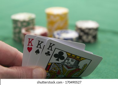 Poker, drei Könige und Spielchips