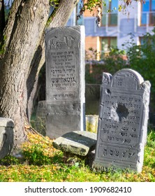 Pruszków, Poland 22.10.2020:  Historic old Jewish cemetery (Kirkut) in Pruszków, a city near Warsaw with tombstones with Hebrew and Polish inscriptions.