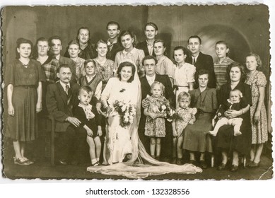 POLAND, CIRCA FORTIES: Unidentified Big Group Of Family Members With Children Gather Together For A Photo With Newlyweds, In Poland, Circa Forties