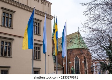 Poland, Cracow, March 06. 2022. Papal And Ukrainian Flag.