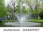 Poland, Czestochowa, Stanislaw Staszic City Park, fountain in the lake