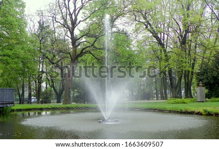 Poland, Czestochowa, Stanislaw Staszic City Park, fountain in the lake