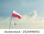 Poland flag waving with flying doves in beautiful sky. Poland flag for Republic Day and Independence Day.