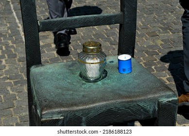 KRAKÓW, POLAND - July 2022. Holocaust Memorial - Ghetto Heroes Square. Art Installation From 2005  - Cast-iron Chairs Reminding Us Of What Was Left After The Liquidation Of The Krakow Ghetto.