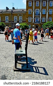 KRAKÓW, POLAND - July 2022. Holocaust Memorial - Ghetto Heroes Square. Art Installation From 2005  - Cast-iron Chairs Reminding Us Of What Was Left After The Liquidation Of The Krakow Ghetto.