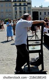 KRAKÓW, POLAND - July 2022. Holocaust Memorial - Ghetto Heroes Square. Art Installation From 2005  - Cast-iron Chairs Reminding Us Of What Was Left After The Liquidation Of The Krakow Ghetto.