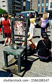 KRAKÓW, POLAND - July 2022. Holocaust Memorial - Ghetto Heroes Square. Art Installation From 2005  - Cast-iron Chairs Reminding Us Of What Was Left After The Liquidation Of The Krakow Ghetto.