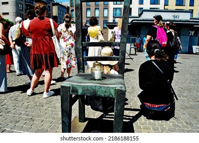 KRAKÓW, POLAND - July 2022. Holocaust Memorial - Ghetto Heroes Square. Art Installation From 2005  - Cast-iron Chairs Reminding Us Of What Was Left After The Liquidation Of The Krakow Ghetto.