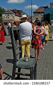 KRAKÓW, POLAND - July 2022. Holocaust Memorial - Ghetto Heroes Square. Art Installation From 2005  - Cast-iron Chairs Reminding Us Of What Was Left After The Liquidation Of The Krakow Ghetto.