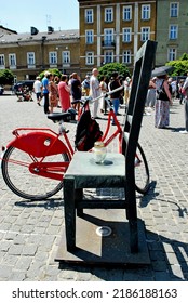 KRAKÓW, POLAND - July 2022. Holocaust Memorial - Ghetto Heroes Square. Art Installation From 2005  - Cast-iron Chairs Reminding Us Of What Was Left After The Liquidation Of The Krakow Ghetto.