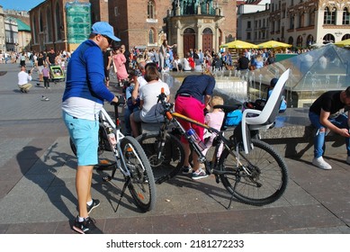 KRAKÓW, POLAND - July 2022. Tourists At The Historic Main Square. In The Heart Of Krakow's Old Town. UNESCO List 1978.  