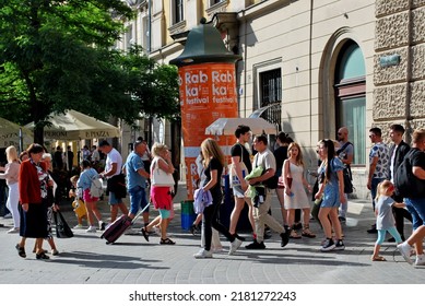 KRAKÓW, POLAND - July 2022. Tourists At The Historic Main Square. In The Heart Of Krakow's Old Town. UNESCO List 1978.  