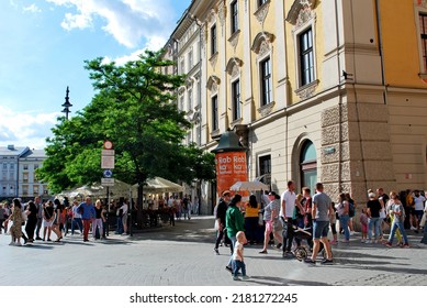 KRAKÓW, POLAND - July 2022. Tourists At The Historic Main Square. In The Heart Of Krakow's Old Town. UNESCO List 1978.  