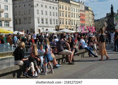 KRAKÓW, POLAND - July 2022. Tourists At The Historic Main Square. In The Heart Of Krakow's Old Town. UNESCO List 1978.  