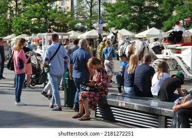 KRAKÓW, POLAND - July 2022. Tourists At The Historic Main Square. In The Heart Of Krakow's Old Town. UNESCO List 1978.  