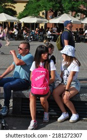 KRAKÓW, POLAND - July 2022. Tourists At The Historic Main Square. In The Heart Of Krakow's Old Town. UNESCO List 1978.  