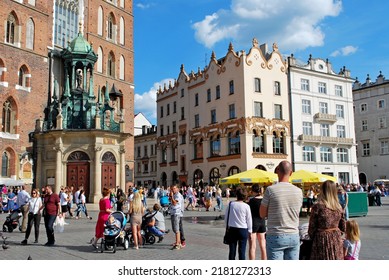 KRAKÓW, POLAND - July 2022. Tourists At The Historic Main Square. In The Heart Of Krakow's Old Town. UNESCO List 1978.  