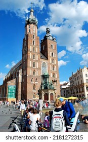 KRAKÓW, POLAND - July 2022. Tourists At The Historic Main Square. In The Heart Of Krakow's Old Town. UNESCO List 1978.  