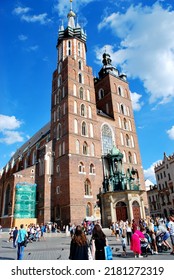 KRAKÓW, POLAND - July 2022. Tourists At The Historic Main Square. In The Heart Of Krakow's Old Town. UNESCO List 1978.  