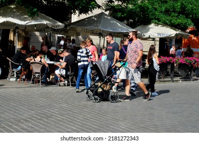 KRAKÓW, POLAND - July 2022. Tourists At The Historic Main Square. In The Heart Of Krakow's Old Town. UNESCO List 1978.  