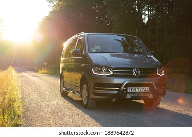 Łódź, Łódzkie, Poland, June, 12, 2020 - Modern, VW Caravelle Bulli - Limited Edition 30, generation 6, with additional car piping - best car for long trips.
Car stands on a gravel road in the forest.