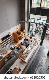 POLAND, KRAKOW - JULY 13, 2016: Interior Of A Small Cafe With Breakfasts In Loft-style. The Bar Counter. View From Above