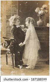 POLAND, WARSAW - CIRCA 1920s: Old Photo  Of Cute Children In Wedding Dress Dress. Illustrative Image, Subject Of Human Interest