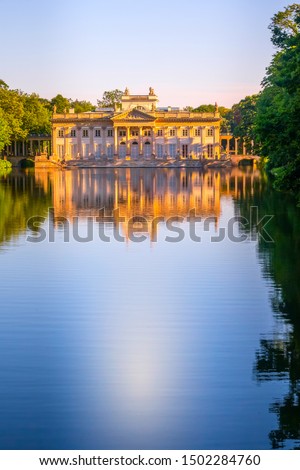 Poland, Warsaw. Lazienki palace with reflection in pond water in the park, Lazienki Krolewskie