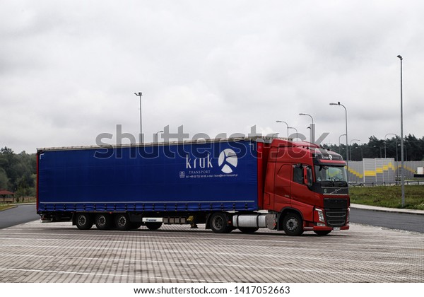 Poland, Warsaw - September 14,\
2018: Large Parking with truck on the track on a summer day in\
Poland