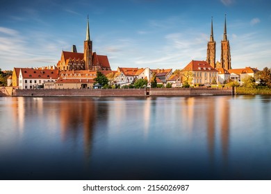 Poland, Wroclaw cityscape. Wroclaw historic old town by Odra river. The Cathedral of St. John the Baptist at the sunset. Famous polish landmarks. - Shutterstock ID 2156026987