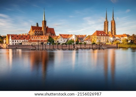 Poland, Wroclaw cityscape. Wroclaw historic old town by Odra river. The Cathedral of St. John the Baptist at the sunset. Famous polish landmarks.