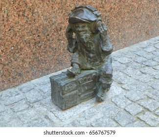 Poland, Wroclaw, Dwarf Listening To Radio