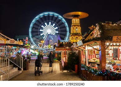 POZNAŃ, POLAND-18 DEC 2019: Traditional Christmas market in Europe. In Poznań, the fair is located on Freedom Square. - Shutterstock ID 1789250240