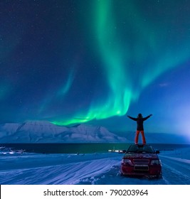 The Polar Arctic Northern Lights Aurora Borealis Sky Star In Norway Svalbard In Longyearbyen City Man Car
 The Moon Mountains