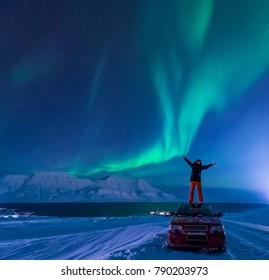 The Polar Arctic Northern Lights Aurora Borealis Sky Star In Norway Svalbard In Longyearbyen City Man Car
 The Moon Mountains