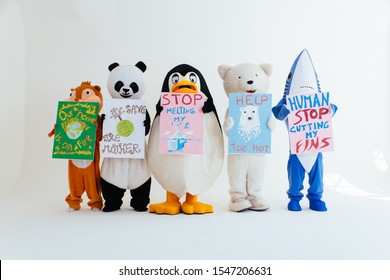 Polar bear and animal mascots characters with a message for humanity, about global warming and pollution problems on our planet