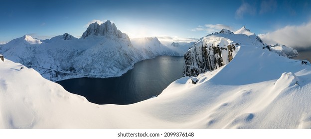 Polar night, Senja panoramic view landscape nordic snow cold winter norway ocean cloudy sky snowy mountains. Troms county, Fjordgard, Mefjorden, Norway  - Powered by Shutterstock