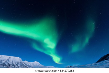 The Polar Northern  Lights In Norway Svalbard In The Mountains