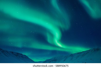 The Polar Northern Lights In Norway Svalbard In The Mountains