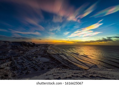 Polar stratospheric clouds during sunrise. Coastline top view. January 2020, Vik, Iceland. - Powered by Shutterstock