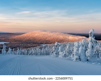 Polar sunrise view of ski slopes and mountains in Levi, Kittilä, Lapland, Finland