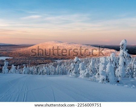 Polar sunrise view of ski slopes and mountains in Levi, Kittilä, Lapland, Finland