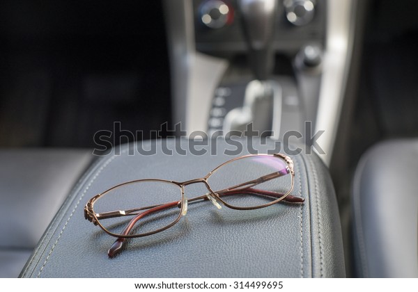 Polarized night driving glasses in dark leather\
car interior